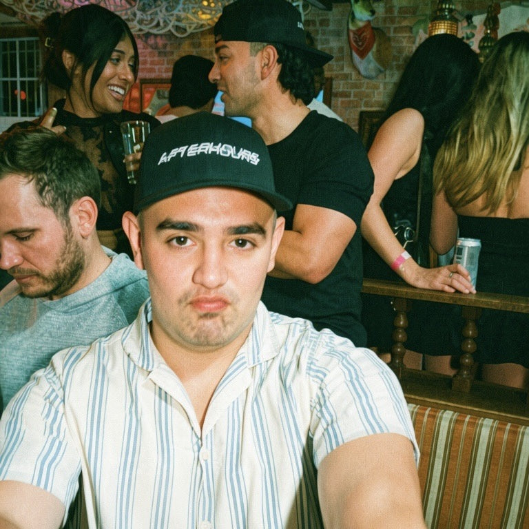 Man wearing the Afterhours Blackout hat on a night out